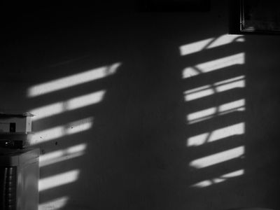 Abstract shadows on a white wall in gym.