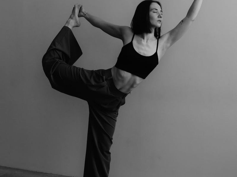 Wide shot of a modern minimalist fitness studio space.